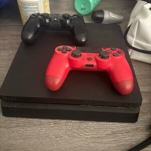 Sony PlayStation 4 Console with Red and Black Controllers